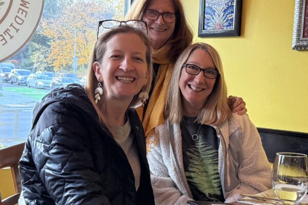 Three ladies posing and smiling