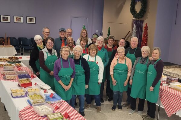 cookie walk workers posing and smiling